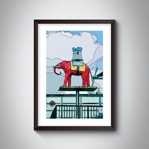 Könnte beinhalten: Eine rote Elefanten-Skulptur mit einem grauen Turm auf dem Rücken, die auf einer Plattform mit blauem und grünem Hintergrund steht. Die Skulptur ist im Cartoon-Stil gehalten.