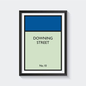 May include: A black framed print with a blue and green color scheme. The print features the text "DOWNING STREET No. 10".