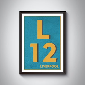 May include: A framed print with a blue background and yellow text. The text reads "L12 LIVERPOOL".