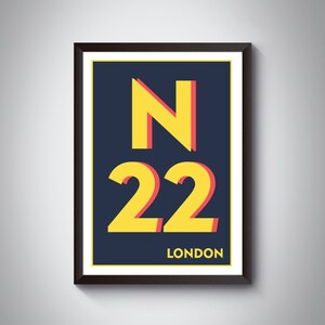 May include: A framed print with a yellow and red 'N22 LONDON' design on a dark blue background.