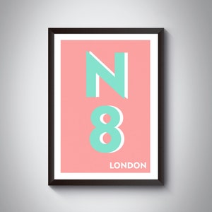 May include: A framed print with a pink background and a teal green "N8 LONDON" design.