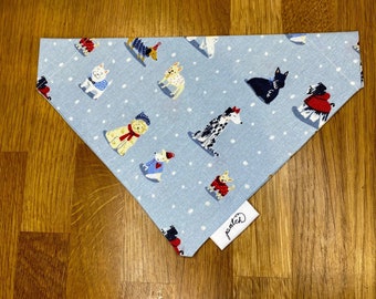 Cute dog bandana blue background with winter dogs on.