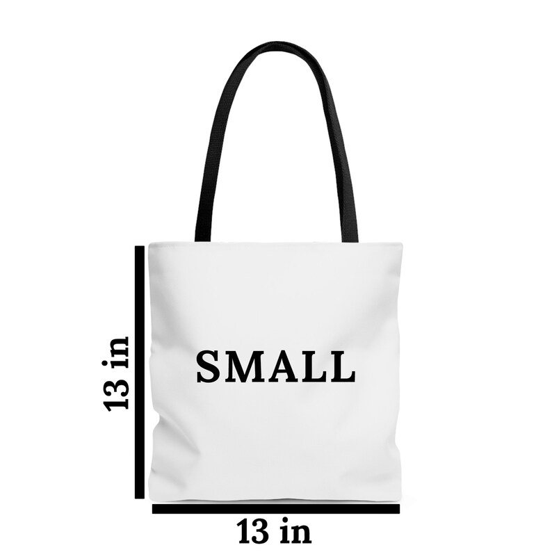 May include: White tote bag with black handles and the word "SMALL" printed in black on the front. The bag measures 13 inches wide and 13 inches tall.