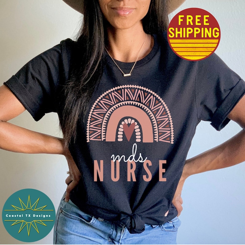 May include: Black t-shirt with a pink and brown rainbow design and the text "mds NURSE".