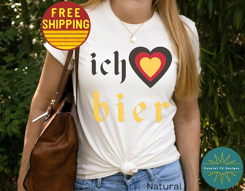 May include: White t-shirt with the text "ich &hearts; bier" in black and yellow lettering. The heart is red, yellow, and black.