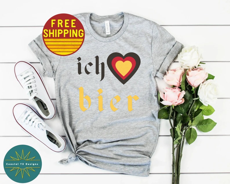 May include: Gray t-shirt with the text "ich &hearts; bier" in yellow and black. The heart is red, yellow, and black.