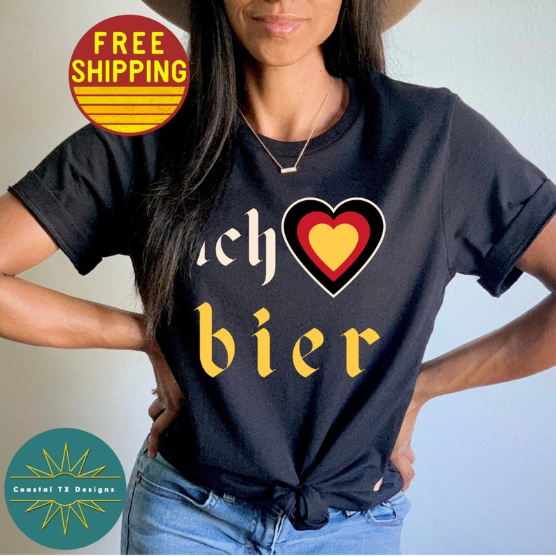 May include: Black t-shirt with a yellow and red heart with the German flag colors and the text "Ich liebe Bier" in yellow.