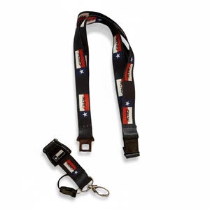 May include: Black lanyard featuring the word "CREW", a Texas flag design, and white stars. Includes a matching keychain with a metal clasp and a black plastic buckle.
