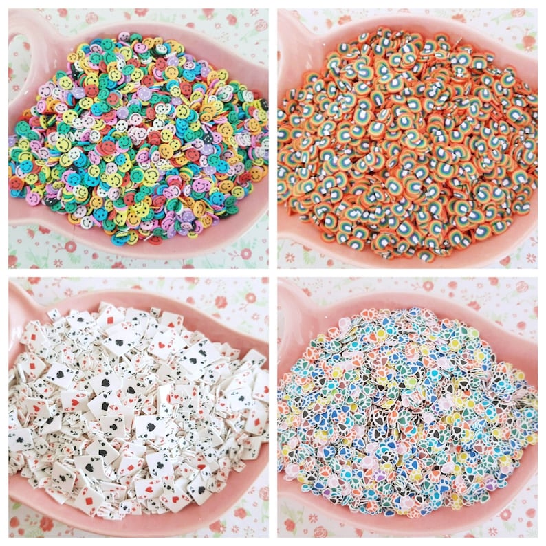 May include: Four bowls filled with colorful polymer clay sprinkles. The sprinkles are shaped like smiley faces, rainbows, playing cards, and flowers.