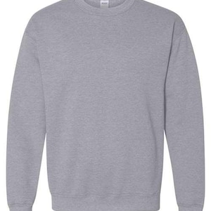 May include: A heather grey sweatshirt with long sleeves and a crew neck.