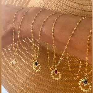 Golden necklace with sun gemstone pendant