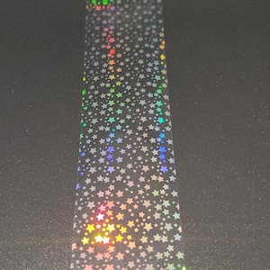 Winzige Holo-Sterne auf klarer Nail Craft Folie