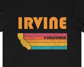 May include: Black t-shirt with a vintage-style graphic of the state of California with the word "IRVINE" and "CALIFORNIA" in orange text.