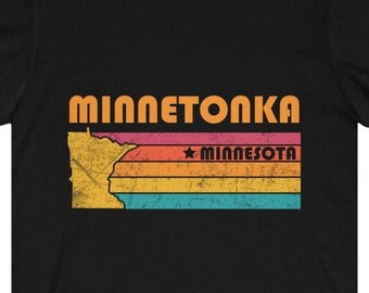 May include: Black t-shirt with a vintage-style graphic of the state of Minnesota with the text "Minnetonka, Minnesota" in orange.