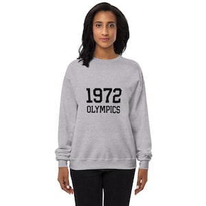 May include: A heather grey sweatshirt with black text that reads "1972 Olympics".