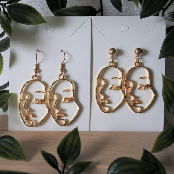 Boucles d'oreilles visage abstrait