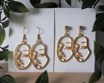 Boucles d'oreilles visage abstrait