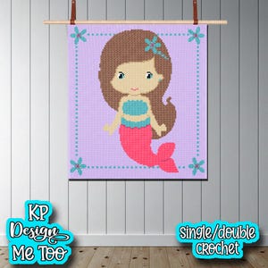 May include: A crocheted mermaid wall hanging. The mermaid has brown hair, blue eyes, and a turquoise top. Her tail is pink, and the background is lavender. The wall hanging is framed with a dotted border and blue flower accents.