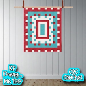 May include: A red, white, and turquoise wall hanging with a geometric design. The hanging is rectangular with a central rectangular pattern and a border of white squares. It is suspended from a wooden rod with leather straps. The text "KP Design Me Too" and "C2C Crochet" are visible.