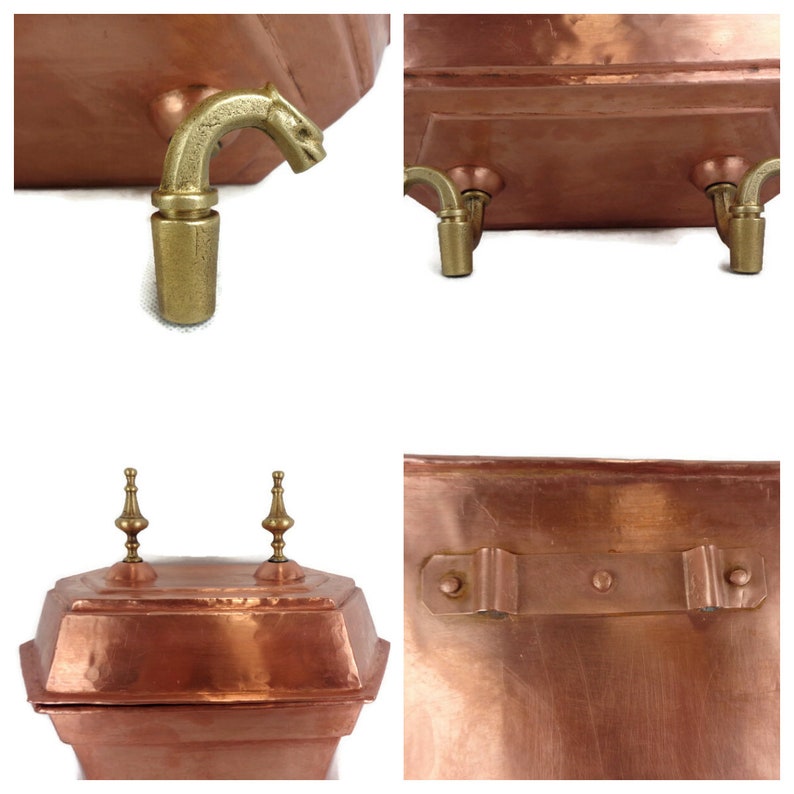 May include: A copper pot with a decorative lid and brass accents. The pot has a hexagonal shape and features a handle on the side. The lid has two decorative brass finials. The pot is sitting on a white surface.