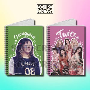 May include: Two spiral bound notebooks with colorful covers. The left notebook has a green cover with a photo of a woman with the text "Jeongyeon" and "ONCE 08". The right notebook has a pink cover with a photo of a group of women with the text "Twice".