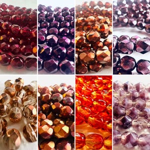 May include: A collage of close-up shots of faceted beads in various shades of red, purple, and copper. The beads have a geometric shape and are strung together, showcasing their reflective surfaces. Ideal for jewelry making or craft projects.