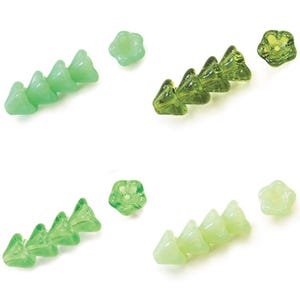 May include: A collection of small, five-petaled flower-shaped beads in various shades of green. The beads are arranged in four small stacks of three, with four individual beads placed separately, showcasing translucent and opaque glass finishes.