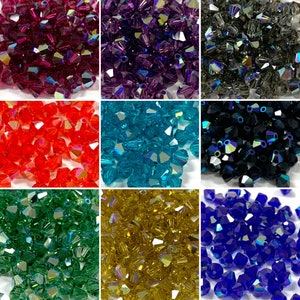 May include: Assortment of 10 different colors of crystal beads. The beads are faceted and have a teardrop shape. The colors are red, blue, green, purple, black, gold, teal, silver, clear, and pink.