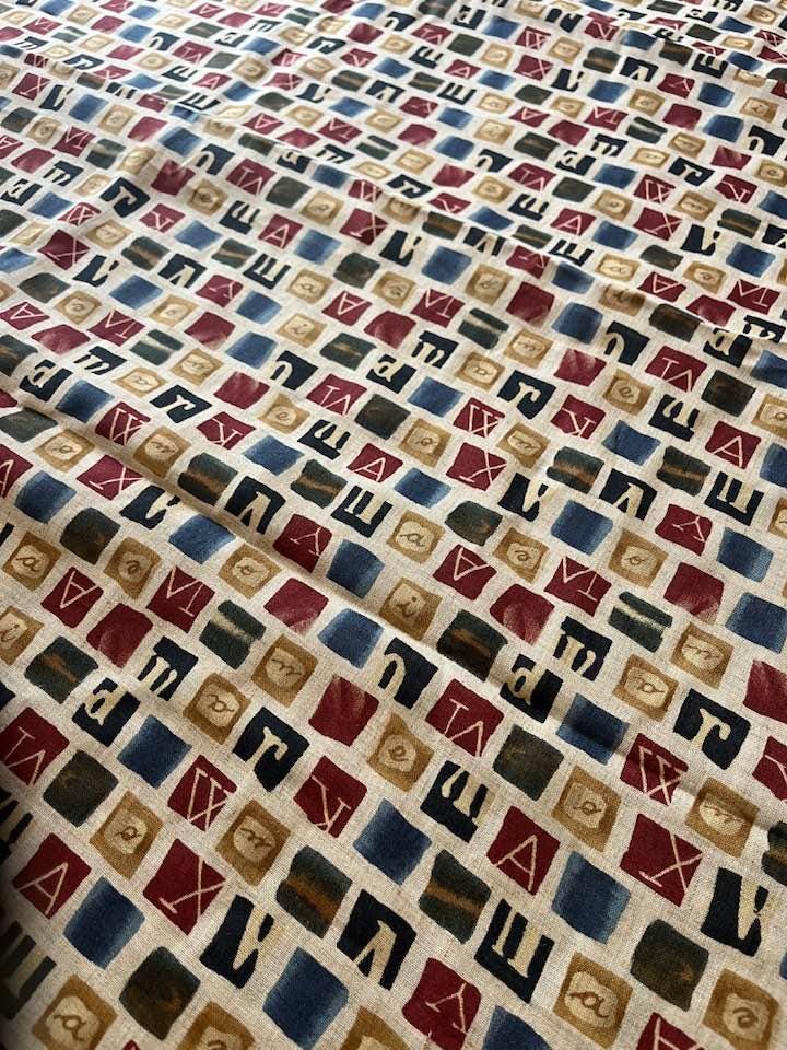 Egyptian hieroglyphics silk fabric- by mylar silk inc