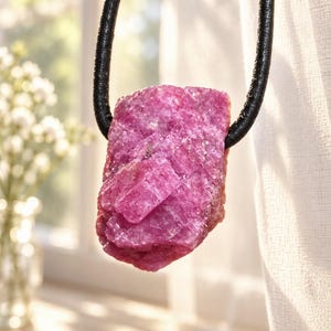 Mysterious ruby ​​raw crystal, carbuncle stone pendant, 20 x 13 x 14 mm, drilled, on an adjustable leather cord