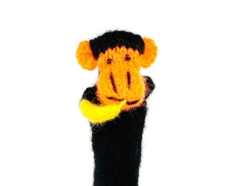 Monkey with banana finger puppet puppet theater for playing and learning from wool knits for children and babies