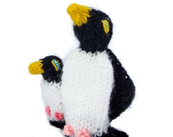 Penguin with baby finger puppet Puppet theater for playing and learning from wool knitting for children and babies
