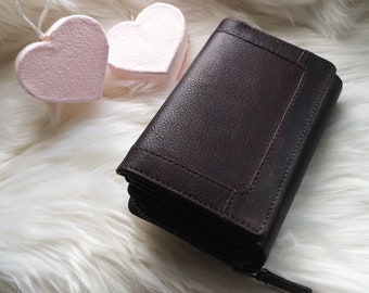 High-quality compact wallet or purse made of genuine leather with RFID protection and many special card slots