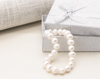 High-quality bracelet made of white freshwater cultured pearls misshapen oval 8-9 mm diameter for women, girls, stretch - elastic-adjustable