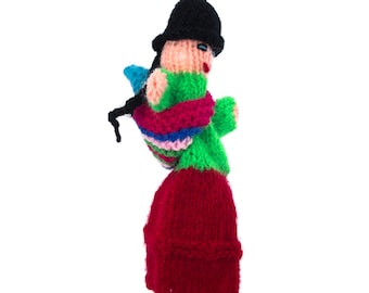 Woman with baby and typical clothes finger puppet puppet theater for playing and learning from wool knits for children and babies