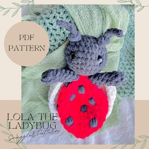 May include: PDF pattern for crocheting a ladybug amigurumi toy named Lola. The toy is gray with red and black spots and is sitting on a white blanket.