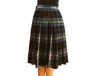 May include: A black, blue and white plaid skirt with pleats. The skirt is knee-length and has a fitted waist.