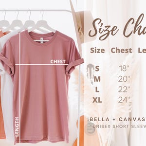a size chart for a t - shirt hanging on a clothes rack