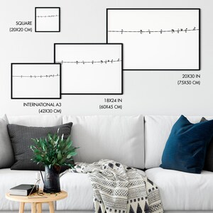 May include: Framed art prints featuring a minimalist design of birds perched on a wire against a white background. Available in various sizes, including 20x30 inches (75x50 cm), 18x24 inches (60x45 cm), and square (20x20 cm).