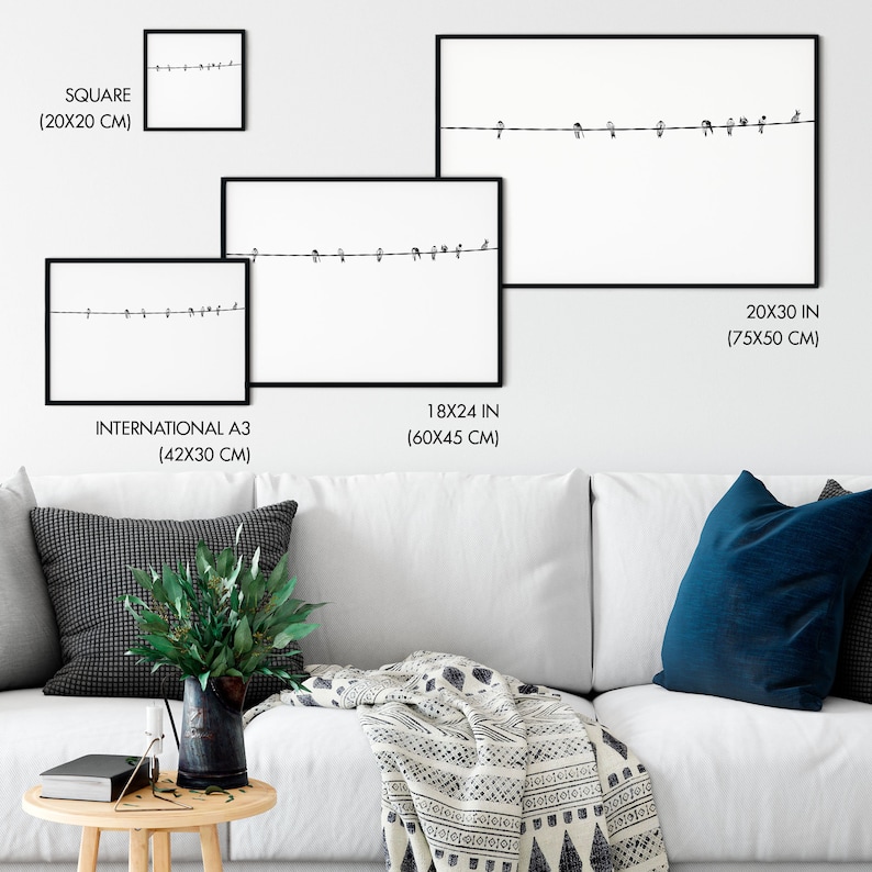 May include: Framed art prints featuring a minimalist design of birds perched on a wire against a white background. Available in various sizes, including 20x30 inches (75x50 cm), 18x24 inches (60x45 cm), and square (20x20 cm).