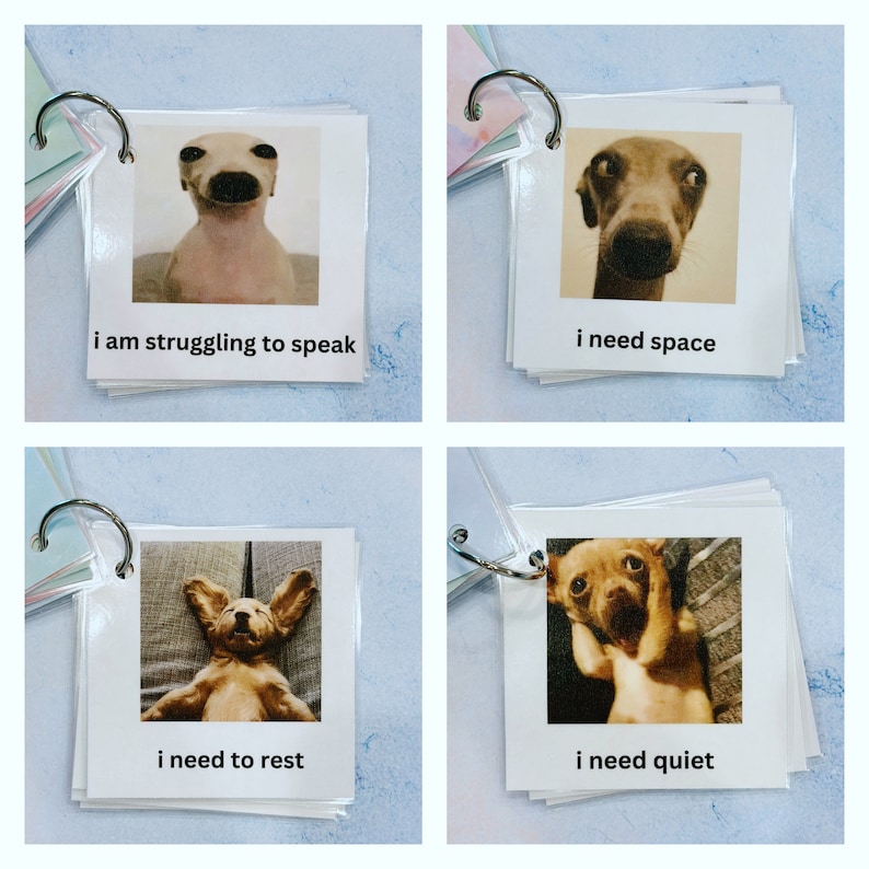 May include: A set of four square cards with dog photos and text: "I am struggling to speak," "I need space," "I need to rest," and "I need quiet." The cards are bound together with a metal ring.