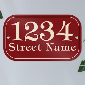 May include: Red house number sign with white lettering. The number 1234 is displayed with the words "Street Name" below.