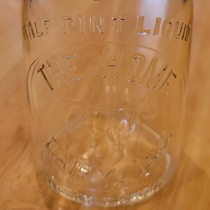 Dairying/ Maine The Home Dairy, INC. Half Pint Glass Milk Bottle/ Lamb Glass Co./ Circa 1940s/ TREHP/ Embossed Cow In Slug Plate/ Maine Seal