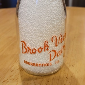 Dairying/ Brook View Dairy/ Bourbonnais, Illinois/ 1961/ Duraglas Glass Company/ Orange Pyroglaze Round Half Pint Glass Milk Bottle/ TRPHP