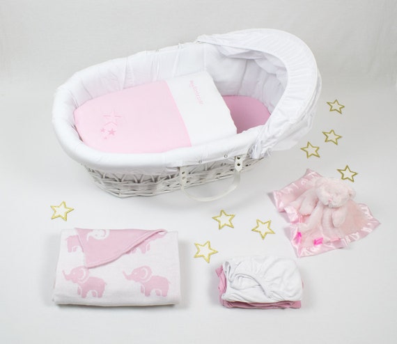 pink moses basket and stand