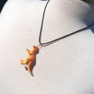 Orange parasaurolophus parasaur dinosaur necklace, upcycled eco friendly reworked jewellery gift ideas, dinosaur jurassic palaeontology 90s