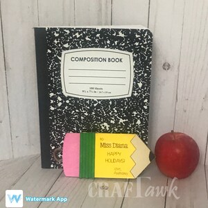 May include: A yellow pencil-shaped card with a pink eraser and green stripes. The card says "to Miss Diana Happy Holidays! love, Anthony".
