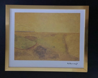May include: A framed print of a landscape painting in shades of yellow and brown. The painting depicts a field with a distant horizon and a signature in the bottom right corner that reads "R. Tamayo".