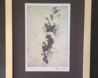 May include: A framed black and white abstract art print with a white background and a black abstract design. The print is signed "Jackson Pollock" in the bottom right corner.