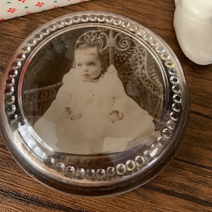 Glass Paperweight of Victorian Baby Circa 1920s